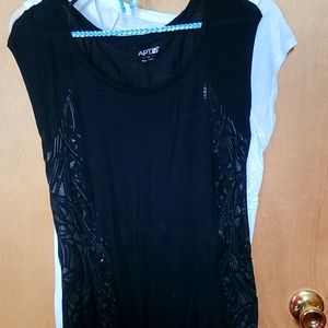 Pair of sleeveless embellished tee shirts being sold together